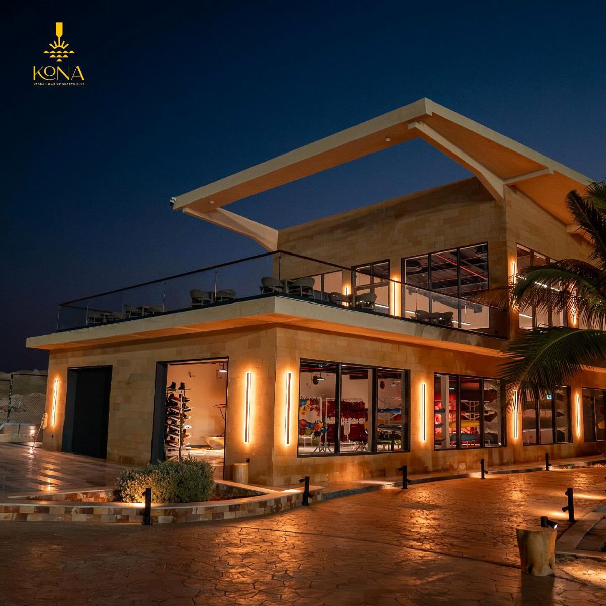 Kona Marine Sport Club’s clubhouse and watersports shop lit up at night