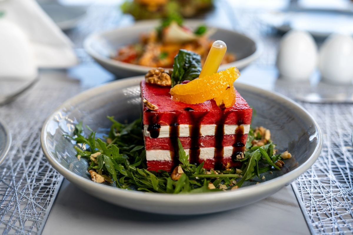 Watermelon and feta stack salad with rocket, walnuts and orange at Kona Marine Sport Club